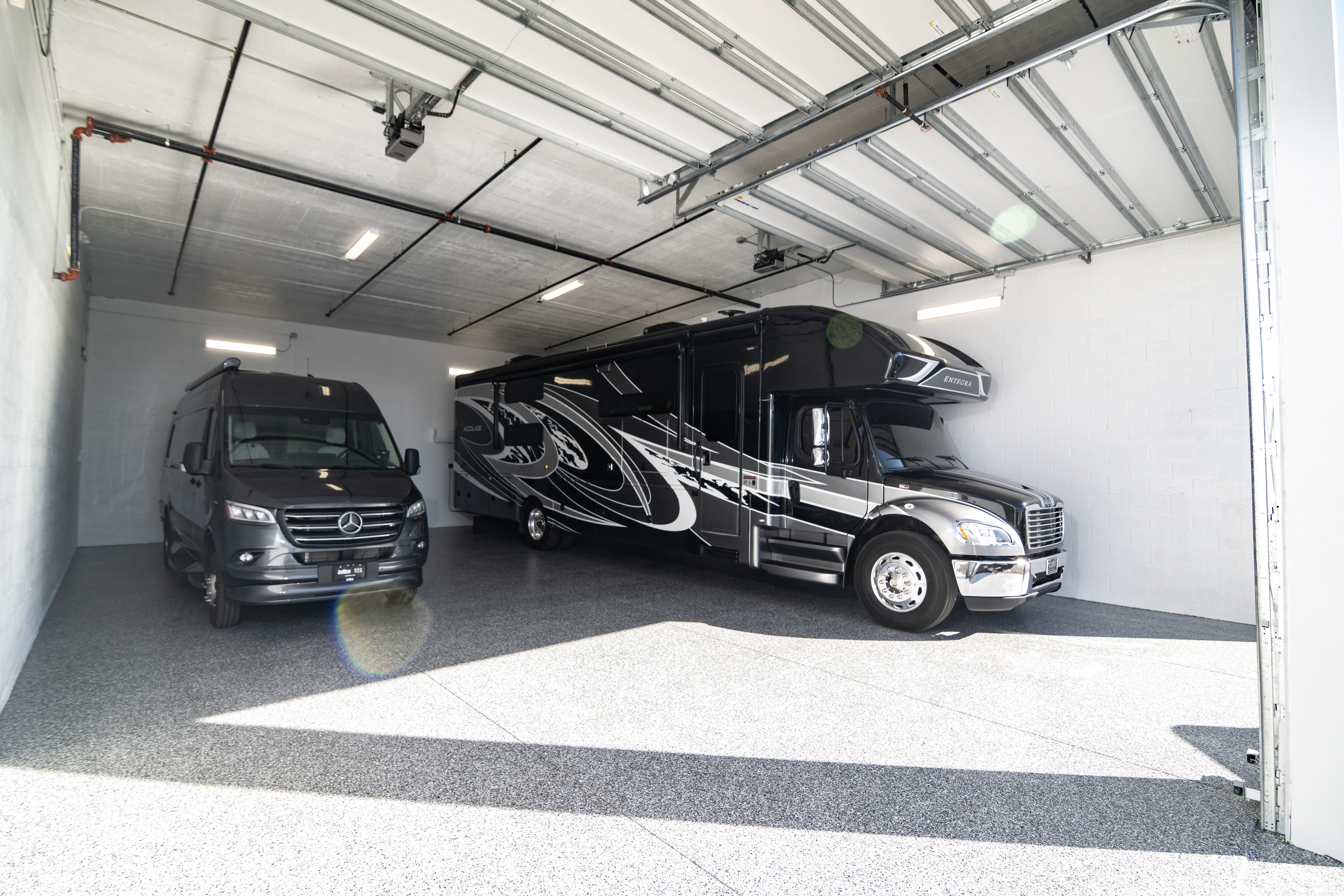 Large Private RV & Van Storage Unit – MetroMaxx Fort Myers Class A motorhome and Mercedes-Benz Sprinter van parked inside a large private climate-controlled storage unit at MetroMaxx RV & Boat Storage in Fort Myers, Florida